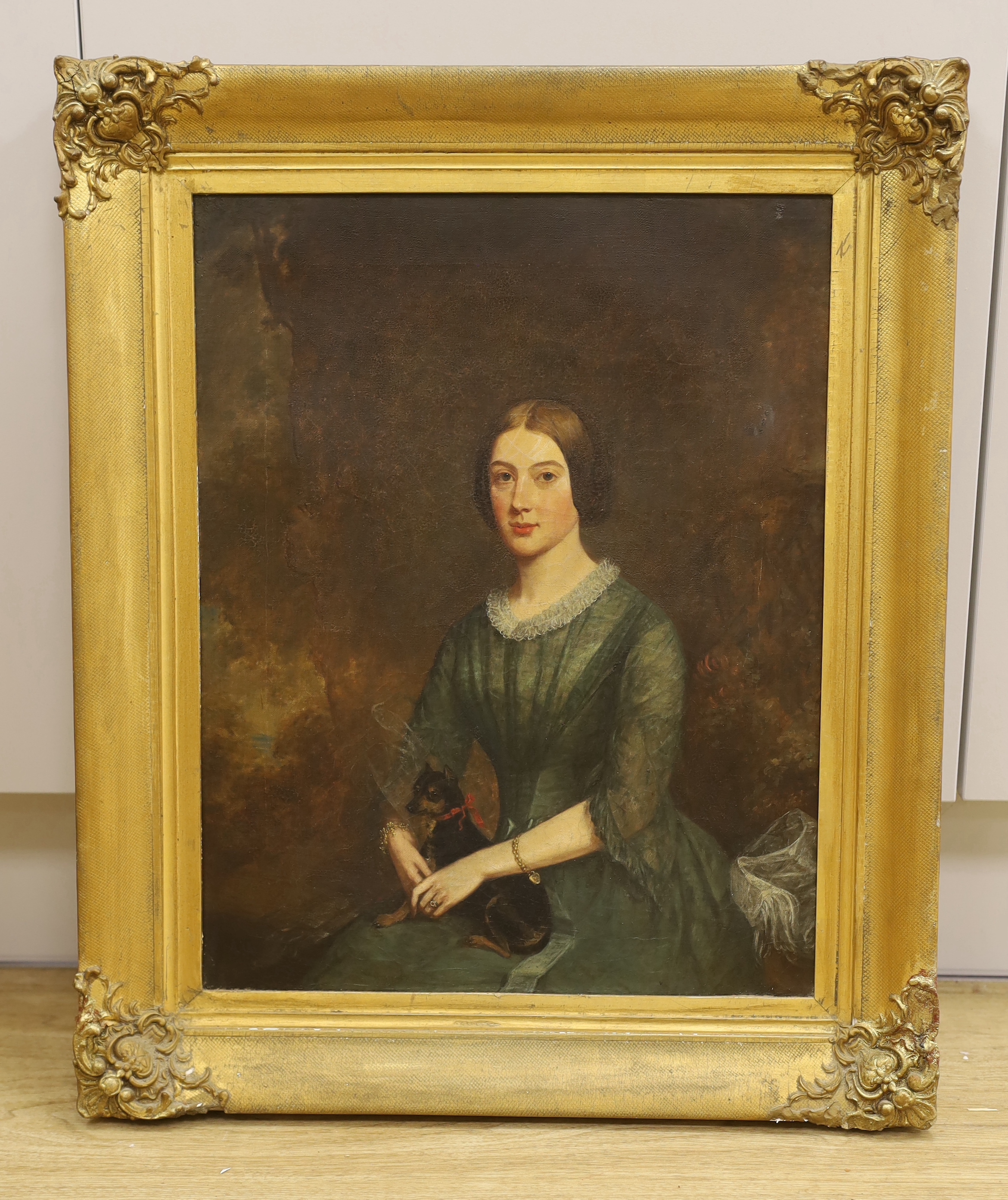 19th century English School, oil on canvas, Three quarter length portrait of a lady and her dog, 44 x 34cm, gilt framed